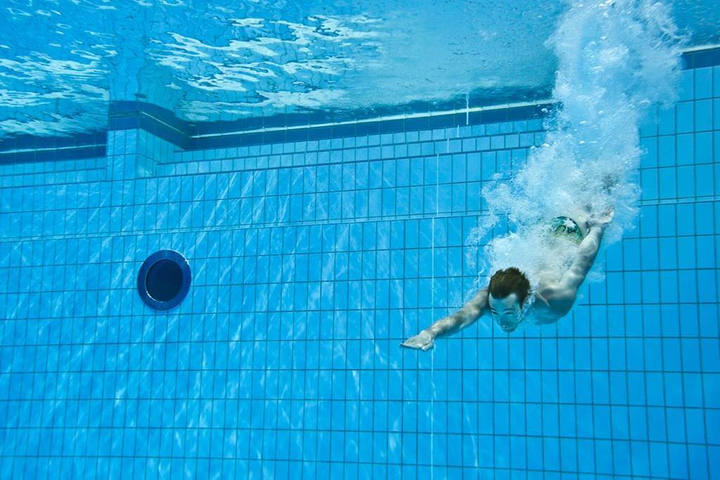 Man diving into pool