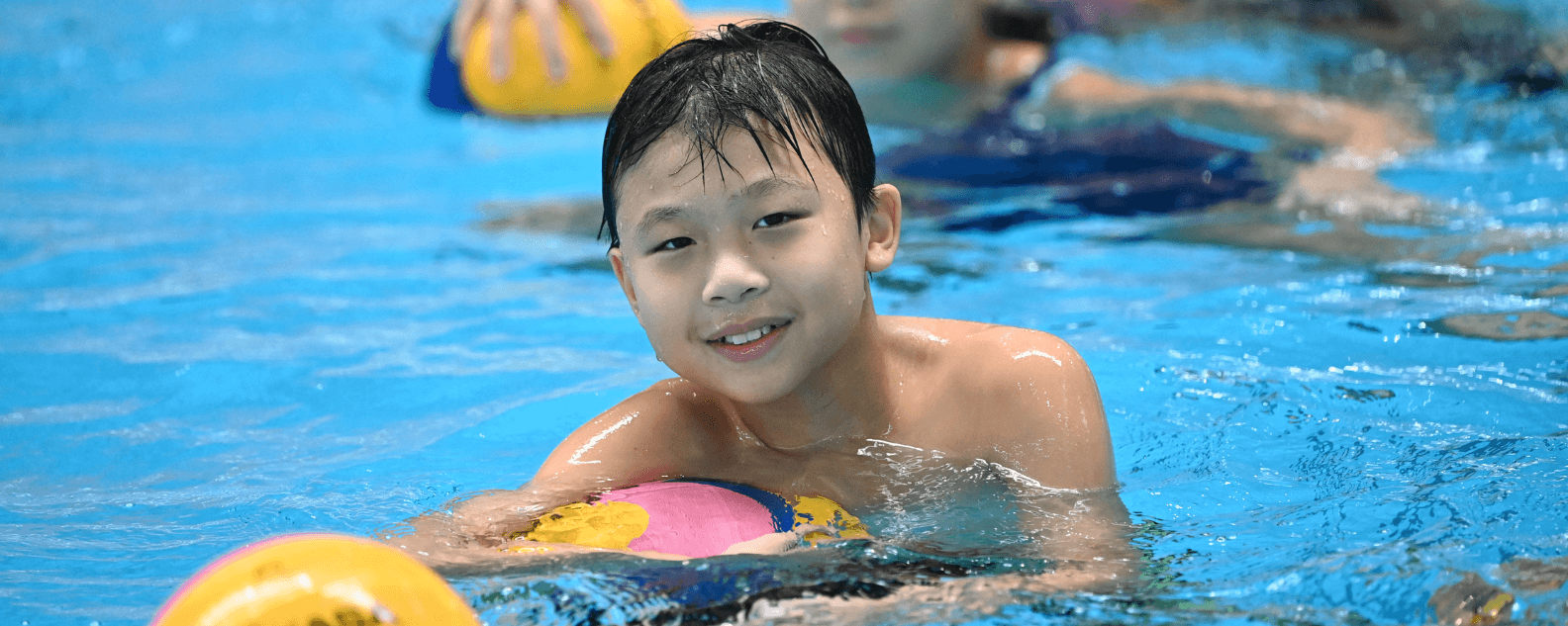 Young child playing water polo