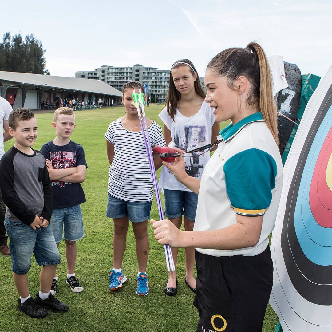Woman teaching an archery program