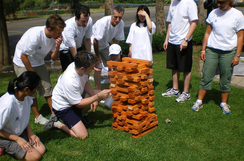 Group playing jenga