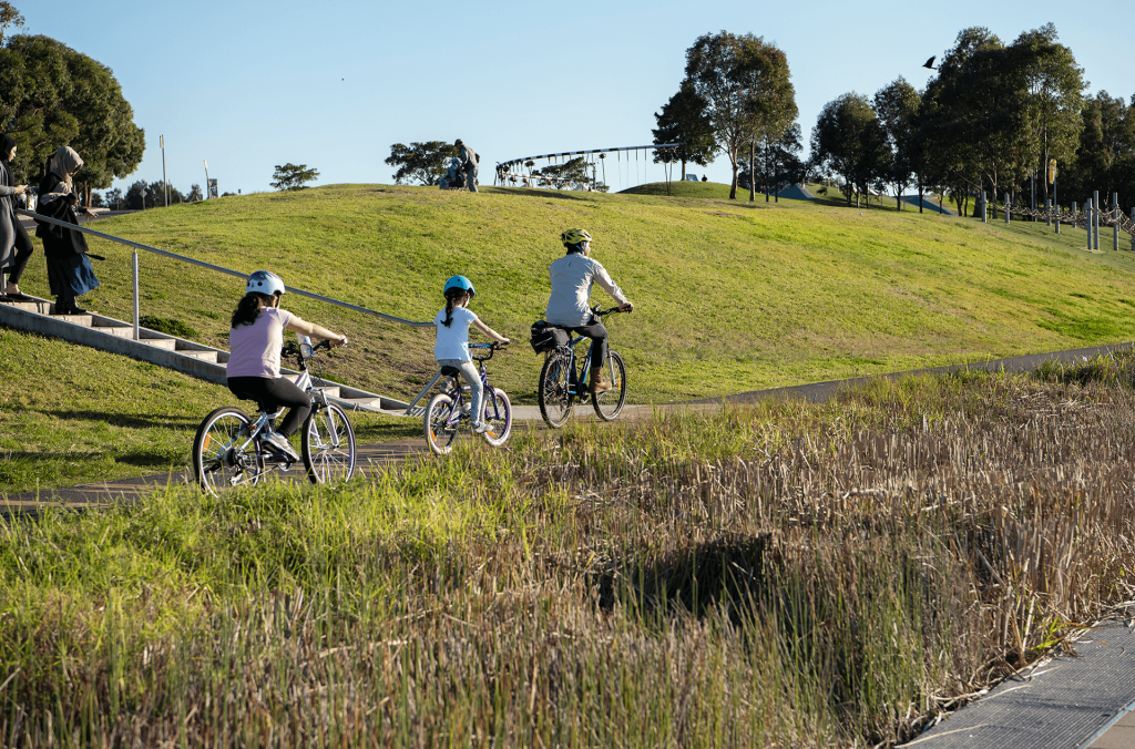 Blaxland Riverside Park children and adult cyclists